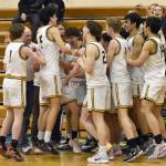 The Seward boys celebrate winning second place and getting a Class 3A state berth Saturday, March 9, 2024, at the Peninsula Conference tournament at Homer High School in Homer, Alaska. (Photo by Jeff Helminiak/Peninsula Clarion)