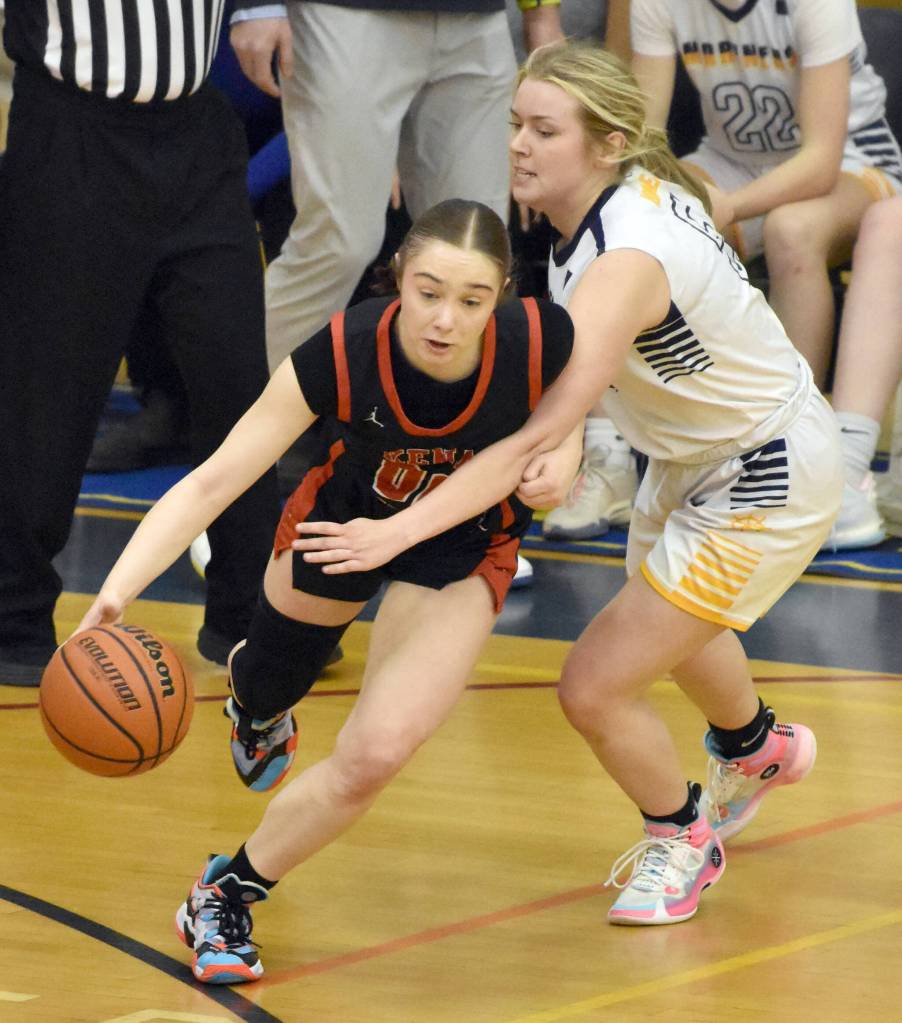 Kenai Centrals Sierra Hershberger dribbles against Homers Minadora Reutov on Saturday, March 9, 2024, at the Peninsula Conference tournament at Homer High School in Homer, Alaska. (Photo by Jeff Helminiak/Peninsula Clarion)