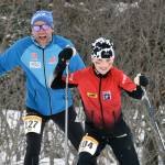 NIva Flagstad, 11, leads her father, Trond Flagstad, associate head coach for men's and women's Nordic skiing at the University of Alaska Anchorage, up a long climb in the Kachemak Ski Marathon just outside of Homer, Alaska, on Saturday, March 16, 2024. (Photo by Erin Thompson/Peninsula Clarion)