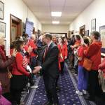 State Sen. Jesse Kiehl, a Juneau Democrat, greets educators and other people rallying in a hallway of the Alaska State Capitol just before the Legislatures override vote on Senate Bill 140 on Monday, March 18, 2024. (Mark Sabbatini / Juneau Empire)