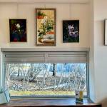Four of Alexandra Sonneborns numerous paintings are on display at the Homer Public Library in the Fireplace Lounge through May. Photo by Christing Whiting