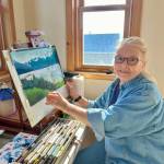 Anchorage and Homer artist Alexandra Sonneborn works on a pastel piece depicting the view from Baycrest Overlook in her studio in Homer, Alaska in March 2024. Photo by Christina Whiting
