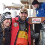 Chris Keithley, 2024 Homer Winter King Salmon Tournament champion, poses with his prize fish after the awards ceremony at the Deep Water Dock on the Spit in Homer, Alaska on Saturday, March 23, 2024. (Delcenia Cosman/Homer News)