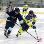 Team Alaskas Logan Mese, of Kenai, beats a defenseman during a win over Northwest Territories in the Arctic Winter Games U18 boys hockey gold medal game. (Jeremiah Bartz/Frontiersman)