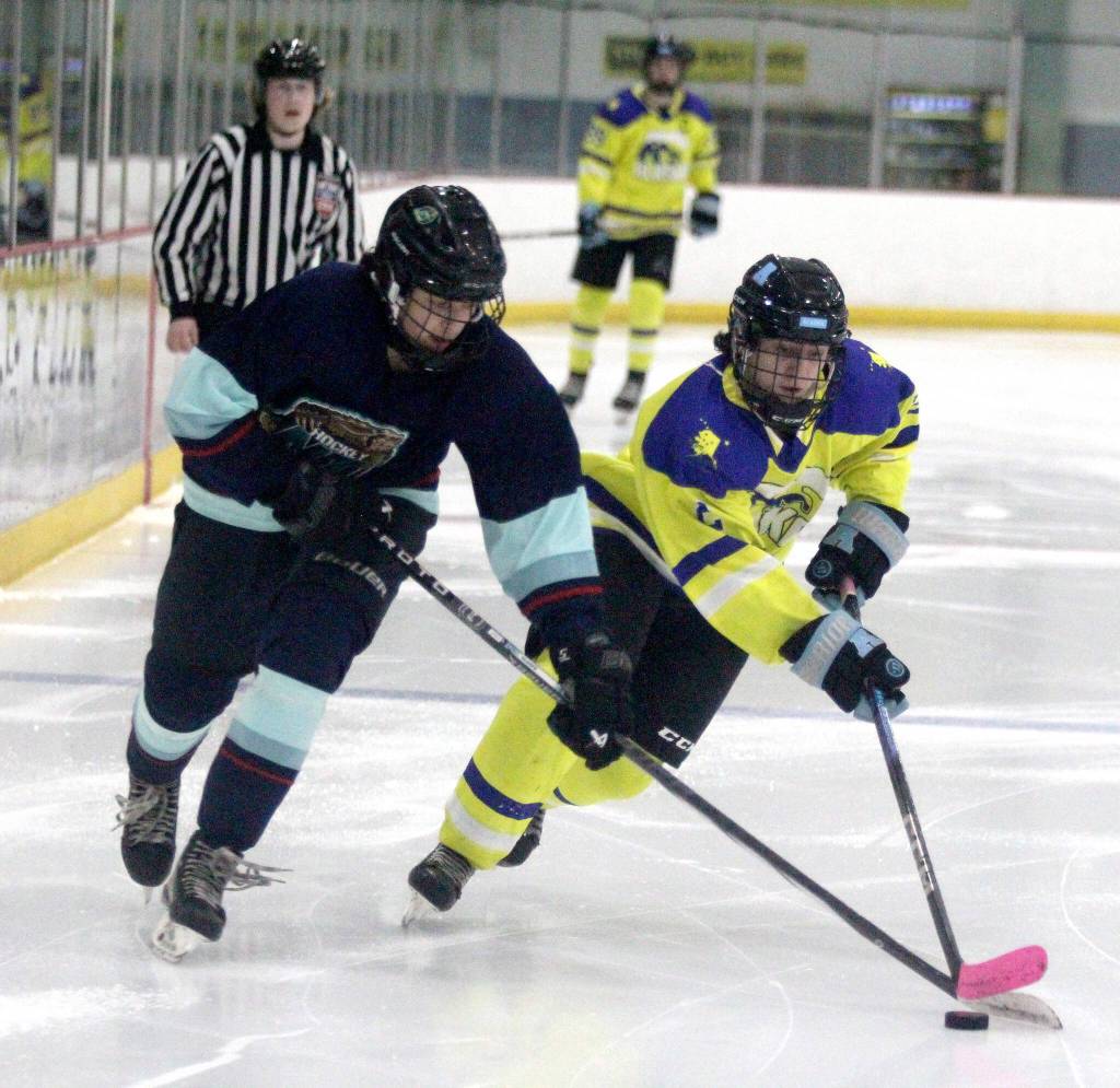Team Alaskas Logan Mese, of Kenai, beats a defenseman during a win over Northwest Territories in the Arctic Winter Games U18 boys hockey gold medal game. (Jeremiah Bartz/Frontiersman)