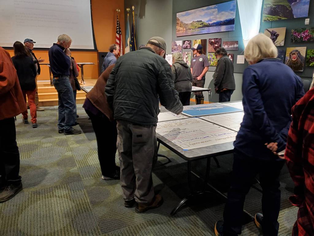 Attendees of the Comprehensive Plan Open House note where they want to see future growth in Homers economy on Thursday, March 28, 2024 at the Alaska Maritime National Wildlife Refuge Visitor Center auditorium in Homer, Alaska. (Delcenia Cosman/Homer News)