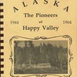 Cover image courtesy of Adrienne Walli Sweeney
The cover of Ella Mae McGanns history book, The Pioneers of Happy Valley, 1944-1964, shows the original homesteading cabin of Homer and Nell Crosby.