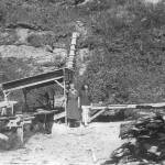 Two unidentified women pose near Rex Hanks sawmill operation near the mouth of Happy Creek, circa 1950. (Photo from Snapshot at Statehood, by the Kenai Peninsula Historical Association)