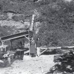 Two unidentified women pose near Rex Hanks sawmill operation near the mouth of Happy Creek, circa 1950. (Photo from Snapshot at Statehood, by the Kenai Peninsula Historical Association)