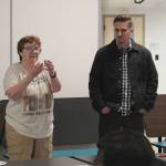 Kenai Peninsula Borough School District Board of Education member Patti Truesdell, left, and Kyle McFall, right, address attendees to gauge interest in a Denaina-focused charter school at a meeting hosted by the Kenaitze Indian Tribe on Thursday, March 28, 2024, in Kenai, Alaska. (Ashlyn OHara/Peninsula Clarion)