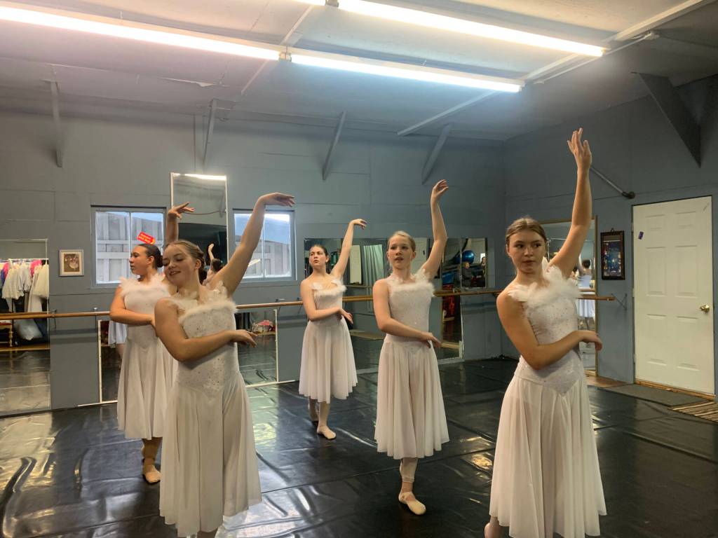 The Swan Corps, including dancers Aria Palma, Piper Arno, Isabelle Ostler, Brenda Pennington and Aurora Springer, rehearse on Thursday, April 4, 2024 at the Art Barn in Homer, Alaska for the Motivity Dance Schools upcoming performance of the Swan Lake ballet. Photo provided by Breezy Berryman