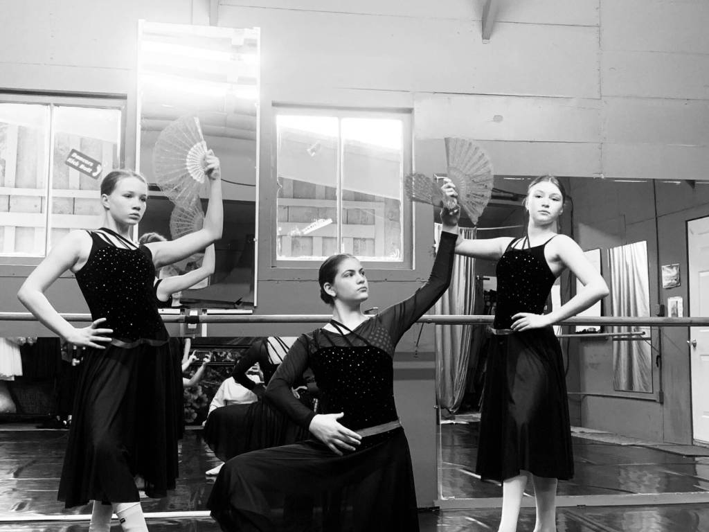 (from left to right) Brenda Pennington, Isabelle Ostler and Aurora Springer rehearse as the Spanish Princesses on Thursday, April 4, 2024 at the Art Barn in Homer, Alaska for the Motivity Dance Schools upcoming performance of the Swan Lake ballet. Photo provided by Breezy Berryman