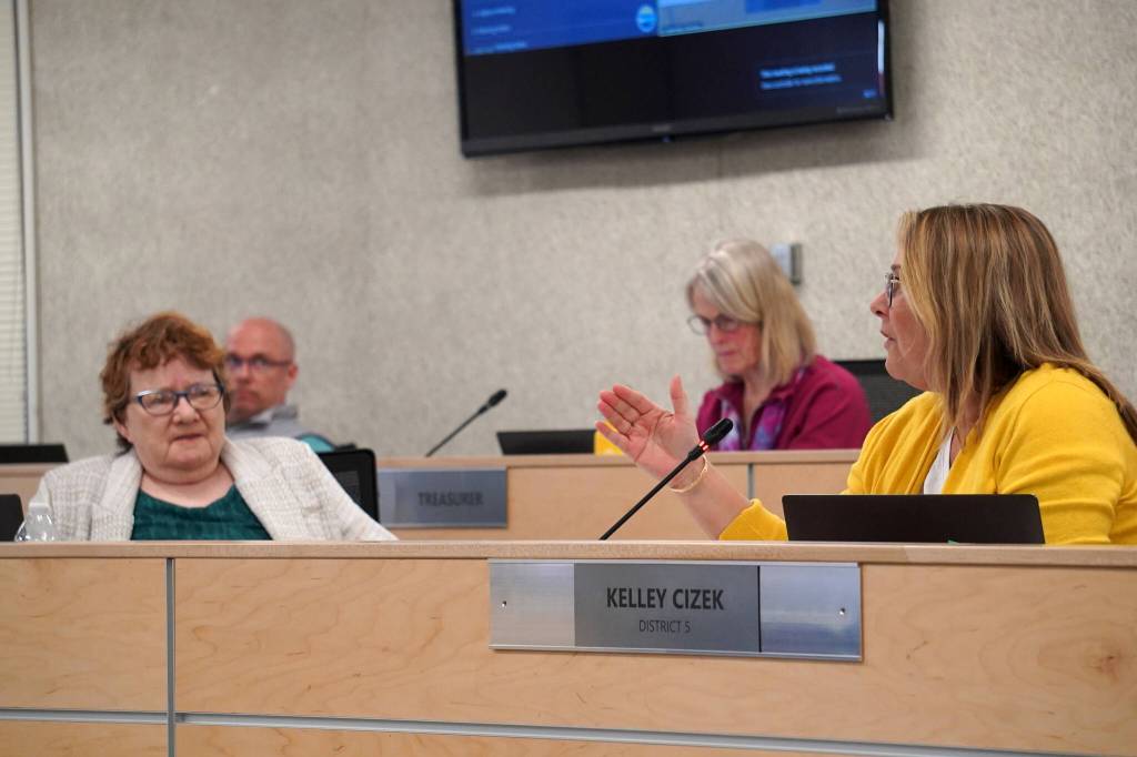 School board member Kelley Cizek, right, speaks as members Jason Tauriainen, Patti Truesdell and Penny Vadla listen during a special meeting of the Kenai Peninsula Borough School Districts School Board in Soldotna, Alaska, on Monday, April 15, 2024. (Jake Dye/Peninsula Clarion)