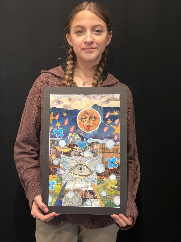 Rachel Munoz, 16, poses with her mixed-media collage titled Observing, on display at Homer Council on the Arts in their annual Jubilee arts exhibit, on Saturday, April 13, 2024 in Homer, Alaska. Photo by Christina Whiting