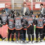 Head coach Taylor Shaw (center) talks to the Kenai River Brown Bears during a timeout at the Soldotna Regional Sports Complex in Soldotna, Alaska, on Saturday, March 23, 2024. (Photo by Jeff Helminiak/Peninsula Clarion)