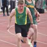 Nick Ambrosiani hands to Ronan Bickling in the 400-meter relay Saturday, April 20, 2024, at the Soldotna Invitational at Soldotna High School in Soldotna, Alaska. (Photo by Jeff Helminiak/Peninsula Clarion)