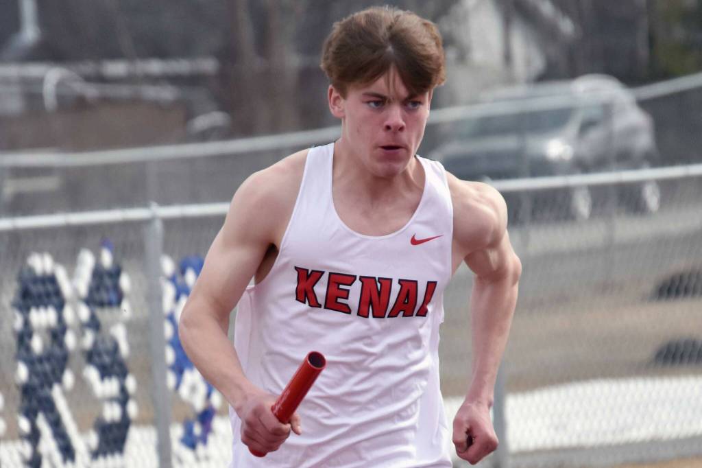 Kenai Central's Greg Fallon runs in the 1,600-meter relay Saturday, April 20, 2024, at the Soldotna Invitational at Soldotna High School in Soldotna, Alaska. (Photo by Jeff Helminiak/Peninsula Clarion)