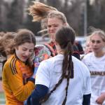 Homer goalie Christi Weisser keeps the ball from Kenai Central's Katie Johnson on Tuesday, April 16, 2024, at Ed Hollier Field at Kenai Central High School in Kenai, Alaska. (Photo by Jeff Helminiak/Peninsula Clarion)