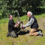 On July 9, Jason Sodergren and retired veterinarian Ralph Broshes capture and attend to crane shot with an arrow. Photo provided by Nina Faust