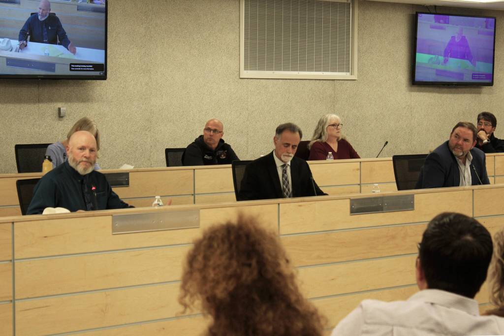 From front left, Connections Homeschool Principal Doug Hayman, Kenai Peninsula Borough Mayor Peter Micciche and KPBSD Superintendent Clayton Holland listen to families during a community conversation on Thursday, Oct. 5, 2023, in Soldotna, Alaska. (Ashlyn OHara/Peninsula Clarion)