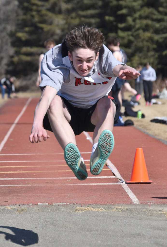Kenai Centrals Hayden Hughes finishes third in the long jump Saturday, April 27, 2024, at the Kenai Invitational at Kenai Central High School in Kenai, Alaska. (Photo by Jeff Helminiak/Peninsula Clarion)