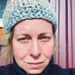 Homer artist Torie Rhyan is photographed on her porch on a sunny day in the spring of 2024 in Homer, Alaska. Photo provided by Torie Rhyan