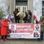 Mark Sabbatini / Juneau Empire
Advocates on behalf of missing and murdered Indigenous persons hold a banner and perform a opening song during a rally in front of the Alaska State Capitol on Sunday to commemorate the annual Missing and Murdered Indigenous Persons Awareness Day.
