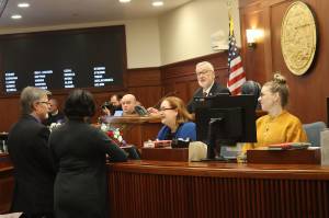 Senate President Gary Stevens, a Kodiak Republican, confers with other senators and legislative staff moments before gavelling in the start of this years legislative session at the Alaska State Capitol on Tuesday, Jan. 16, 2024. (Mark Sabbatini / Juneau Empire)