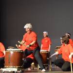 Jacki Holzman (front center) plays Buchi Awase Daiko during Tomodachi Daikos first show at the Homer High School Mariner Theatre on Saturday, May 4, 2024 in Homer, Alaska. (Delcenia Cosman/Homer News)