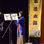Toshifumi Kono (left) and Yurika Kushimoto (right) play fue, or Japanese bamboo flutes, to accompany Tomodachi Daikos taiko drummers during their performance of Alaska Nokokoro during their first show at the Homer High School Mariner Theatre on Saturday, May 4, 2024 in Homer, Alaska.
