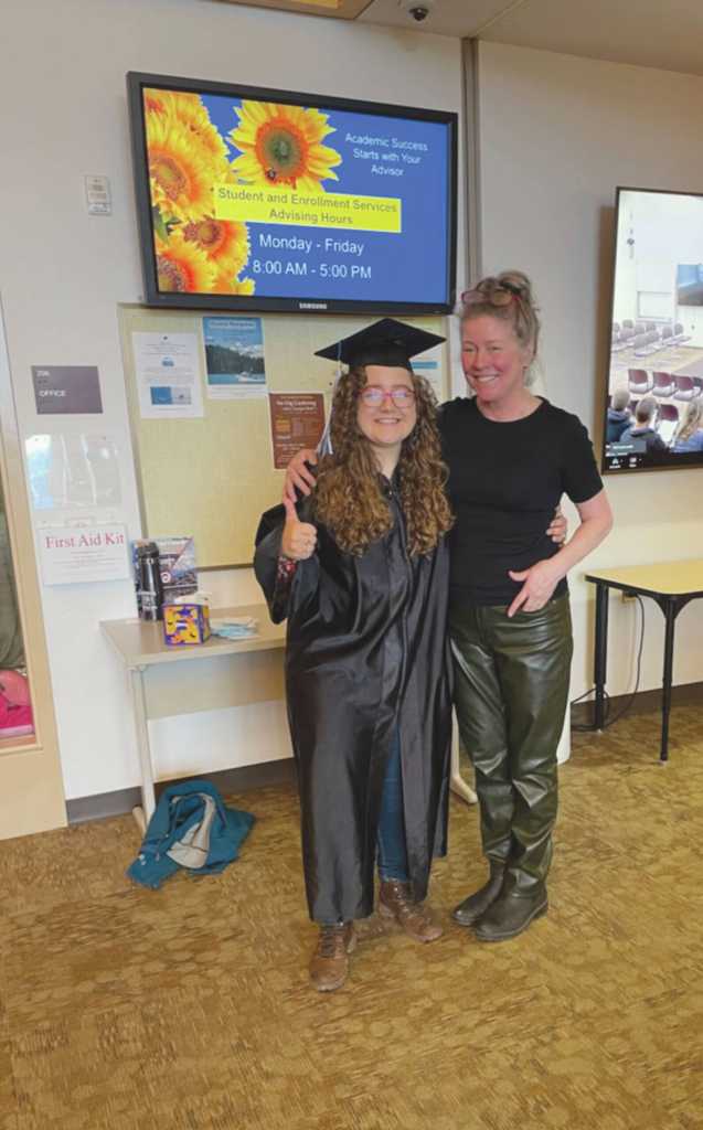 2024 graduate Mercedes Becker and KPC staff member Jill Burnham pose before the commencement event at the Kachemak Bay Campus, May 8, 2024, in Homer, Alaska. (Emilie Springer/ Homer News)