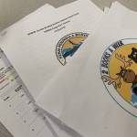 Ashlyn OHara/Peninsula Clarion
The Kenai Peninsula Borough School Districts grant application for funds to support summer reading programs, along with other reading intervention documents, are splayed on a desk in the Peninsula Clarion offices on Monday, May 13, 2024 in Kenai, Alaska.