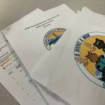 The Kenai Peninsula Borough School Districts grant application for funds to support summer reading programs, along with other reading intervention documents, are displayed on a desk in the Peninsula Clarion offices on Monday, May 13, 2024 in Kenai, Alaska. (Ashlyn OHara/Peninsula Clarion)