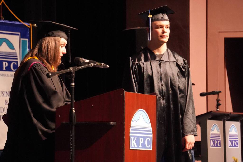 Student Services Director Sara Rinearson names Koleman McCaughey a recipient of the Staff Choice Award during the 54th Annual Kenai Peninsula College Commencement Ceremony at Kenai Central High School in Kenai, Alaska, on Thursday, May 9, 2024. (Jake Dye/Peninsula Clarion)