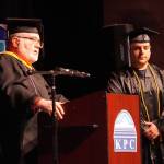 Faculty Chair Bill Howell names David Wolf a recipient of a Faculty Choice Award during the 54th Annual Kenai Peninsula College Commencement Ceremony at Kenai Central High School in Kenai, Alaska, on Thursday, May 9, 2024. (Jake Dye/Peninsula Clarion)