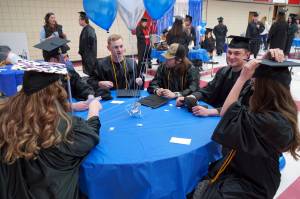 Graduates of Kenai Peninsula College prepare for the 54th Annual Kenai Peninsula College Commencement Ceremony at Kenai Central High School in Kenai, Alaska, on Thursday, May 9, 2024. (Jake Dye/Peninsula Clarion)