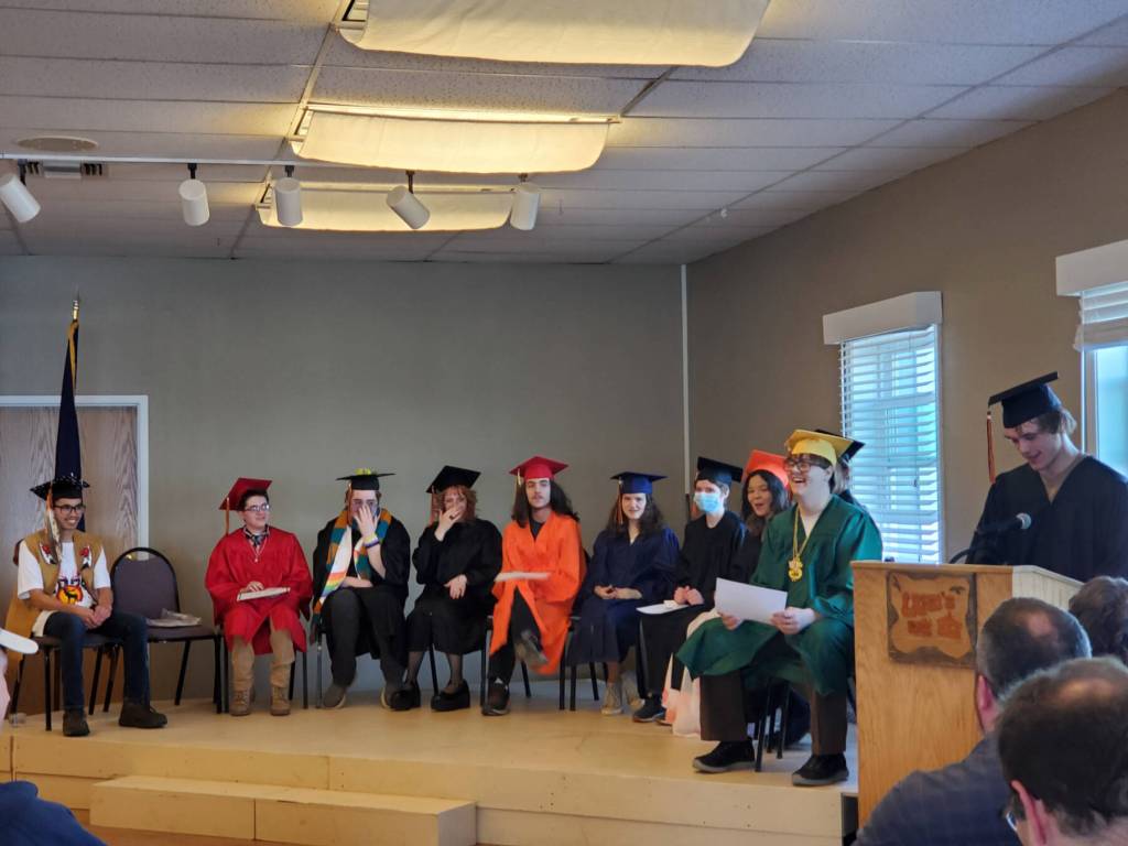 Homer Flex graduates listen to senior Wyatt Counts present his speech to the audience, thanking family, friends and Homer Flex staff at the Homer Flex High School commencement ceremony on Tuesday, May 14, 2024, at Lands End Resort in Homer, Alaska. (Delcenia Cosman/Homer News)
