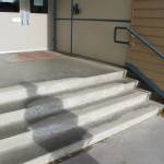 Concrete steps effected by spalling lead to the front entrance of Soldotna Elementary School on Friday, Sept. 30, 2022. (Ashlyn OHara/Peninsula Clarion)