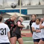 Kenai Centrals Brynnen Hanson and Kate Wisnewski battle for the ball Saturday, May 18, 2024, at the Peninsula Conference tournament at Kenai Central High School in Kenai, Alaska. (Photo by Jeff Helminiak/Peninsula Clarion)