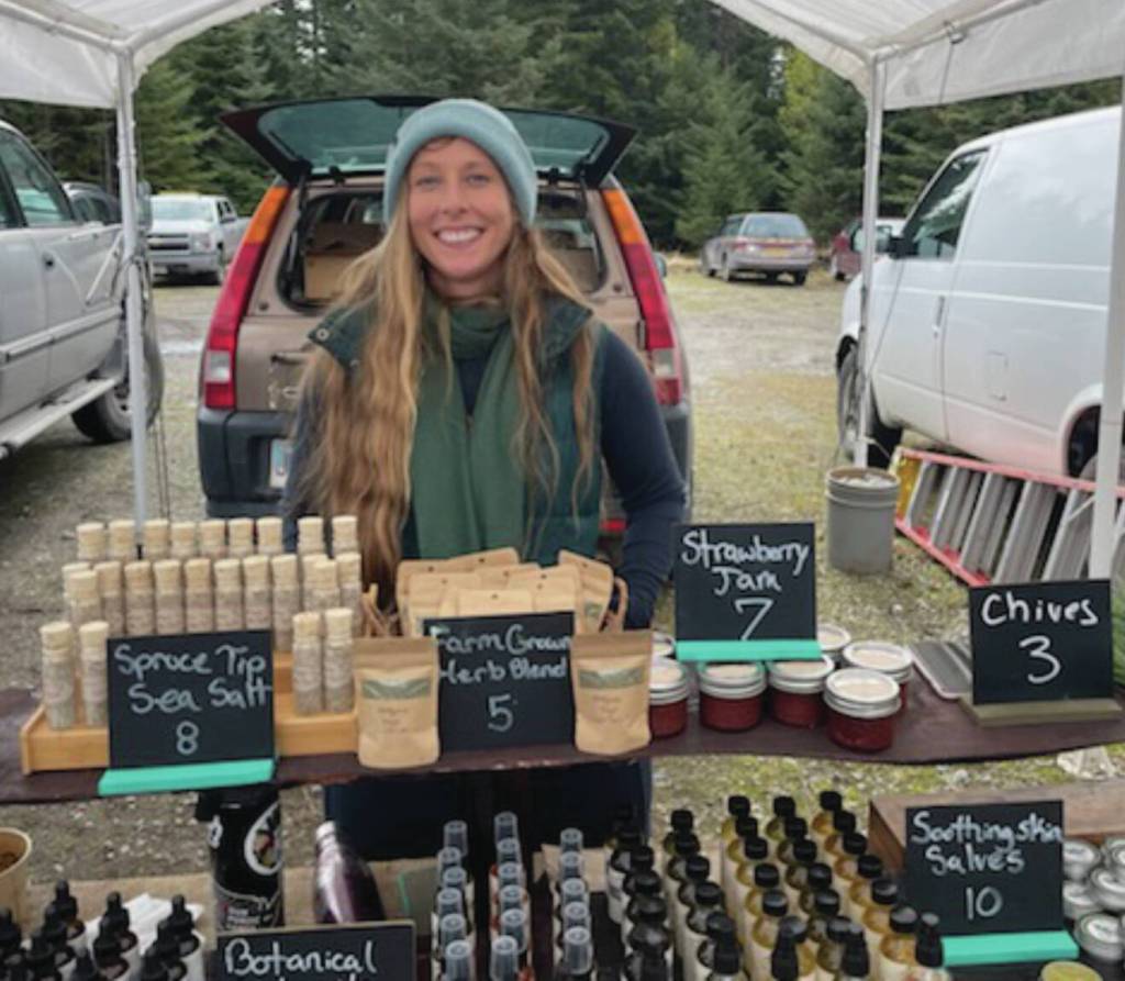 Opening day at the Homer Farmers Market on May 25, Megan Long with Wild Wellness Farm stands in front of her products. Emilie Springer/ Homer News.