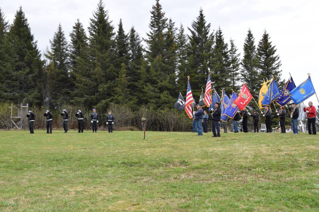 The honor guard (left) fires a three-volley salute during the Memorial Day service held at the Anchor Point Kallman Cemetery on Monday, May 27, 2024 in Anchor Point, Alaska. (Delcenia Cosman/Homer News)