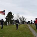 VFW Post 10221 member Eric Henley (center) performs the battlefield cross during a Memorial Day service held at the American Legion Cemetery on Monday, May 27, 2024 in Ninilchik, Alaska. (Delcenia Cosman/Homer News)