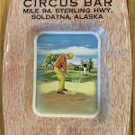 This circa-1950s souvenir ashtray from the Circus Bar was donated to the Soldotna Historical Society by Virgil Dahler. The irony of the illustration in the bottom of the ashtray is that a golf course opened across from the bar in the early 1970s.