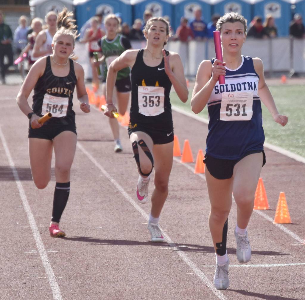 Soldotnas Annie Burns hangs on to second place in the 1,600-meter relay at the Division I state track and field meet Saturday, May 25, 2024, at Dimond High School in Anchorage, Alaska. (Photo by Jeff Helminiak/Peninsula Clarion)