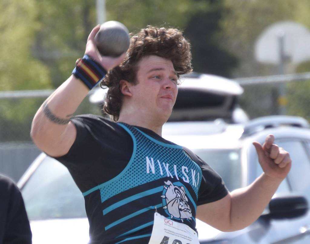 Nikiskis Truit McCaughey finishes second in the shot put at the Division II state track and field meet Saturday, May 25, 2024, at Dimond High School in Anchorage, Alaska. (Photo by Jeff Helminiak/Peninsula Clarion)