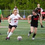 Kenais Kylee Verkuilen battles Juneau-Douglas Cerys Hudson for the ball during the ASAA Soccer Division II State Championships at Veterans Memorial Field in Wasilla, Alaska, on Saturday, May 25, 2024. (Jake Dye/Peninsula Clarion)
