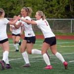 The Kenai Central High School girls celebrate after a goal by Katie Johnson during the ASAA Soccer Division II State Championships at Veterans Memorial Field in Wasilla, Alaska, on Saturday, May 25, 2024. (Jake Dye/Peninsula Clarion)