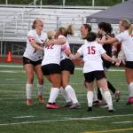 The Kenai Central High School girls celebrate after a goal by Katie Johnson during the ASAA Soccer Division II State Championships at Veterans Memorial Field in Wasilla, Alaska, on Saturday, May 25, 2024. (Jake Dye/Peninsula Clarion)