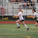 Kenais Tait Cooper and Chloe Grimm race to control the ball during the ASAA Soccer Division II State Championships at Veterans Memorial Field in Wasilla, Alaska, on Saturday, May 25, 2024. (Jake Dye/Peninsula Clarion)