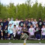 The Soldotna High School boys are awarded the state title after winning the ASAA Soccer Division II State Championships at Veterans Memorial Field in Wasilla, Alaska, on Saturday, May 25, 2024. (Jake Dye/Peninsula Clarion)
